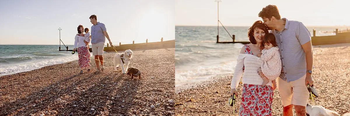 Family enjoying a sunset beach photo shoot on Hayling Island with their two dogs and one-year-old daughter