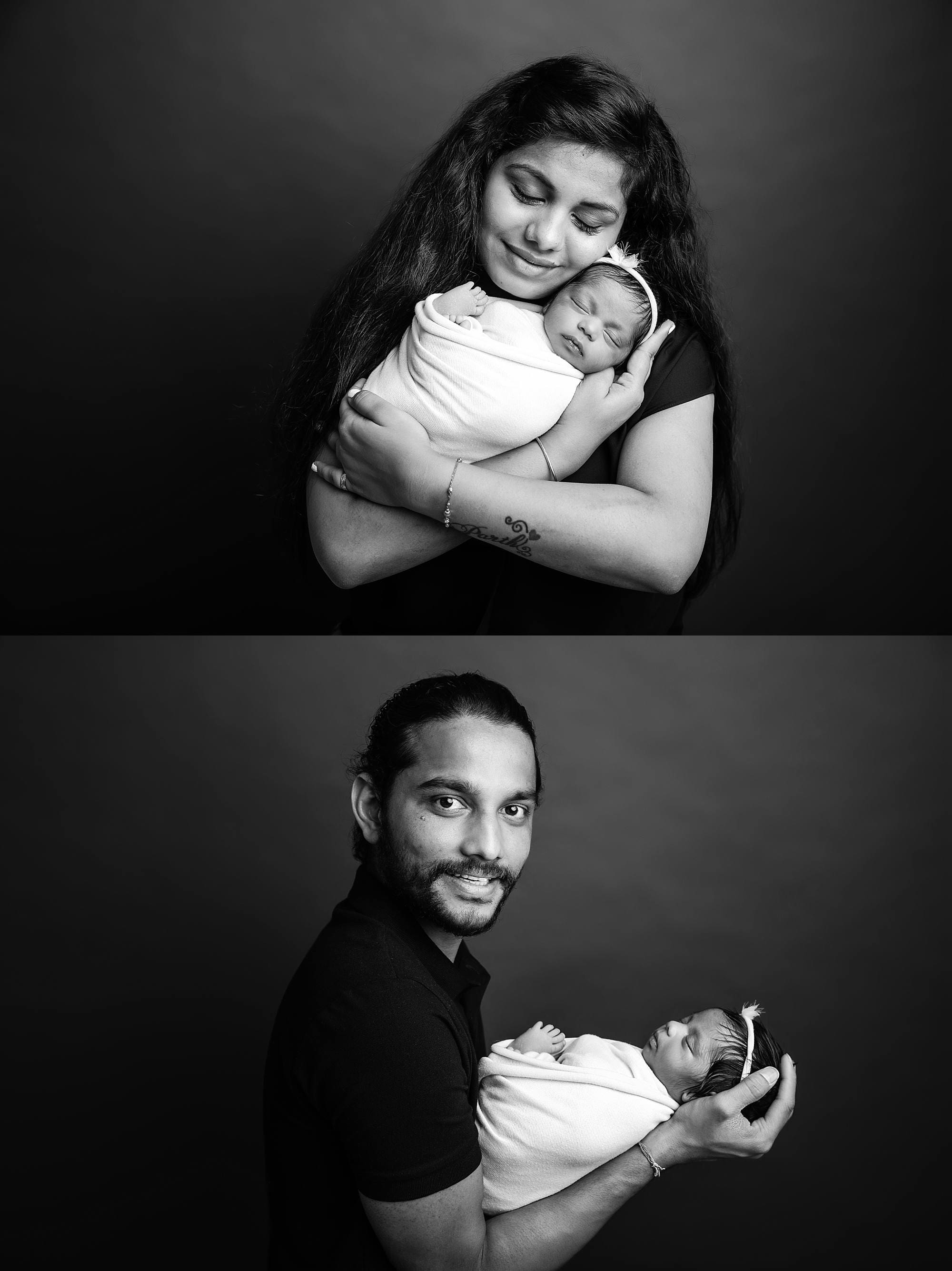 Newborn baby in a peaceful pose with barents black and white captured by photographer in Emsworth, Hampshire