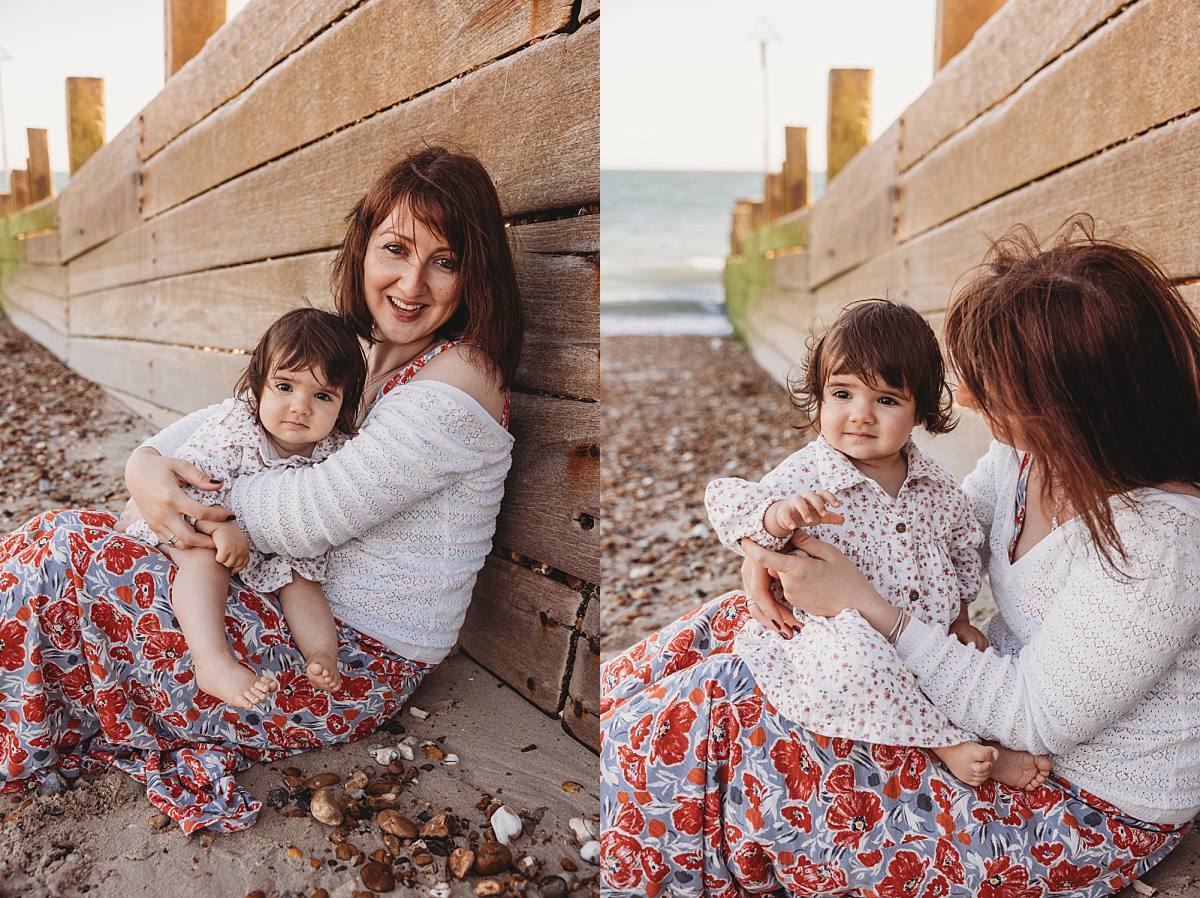 Family enjoying a sunset beach photo shoot on Hayling Island with their two dogs and one-year-old daughter