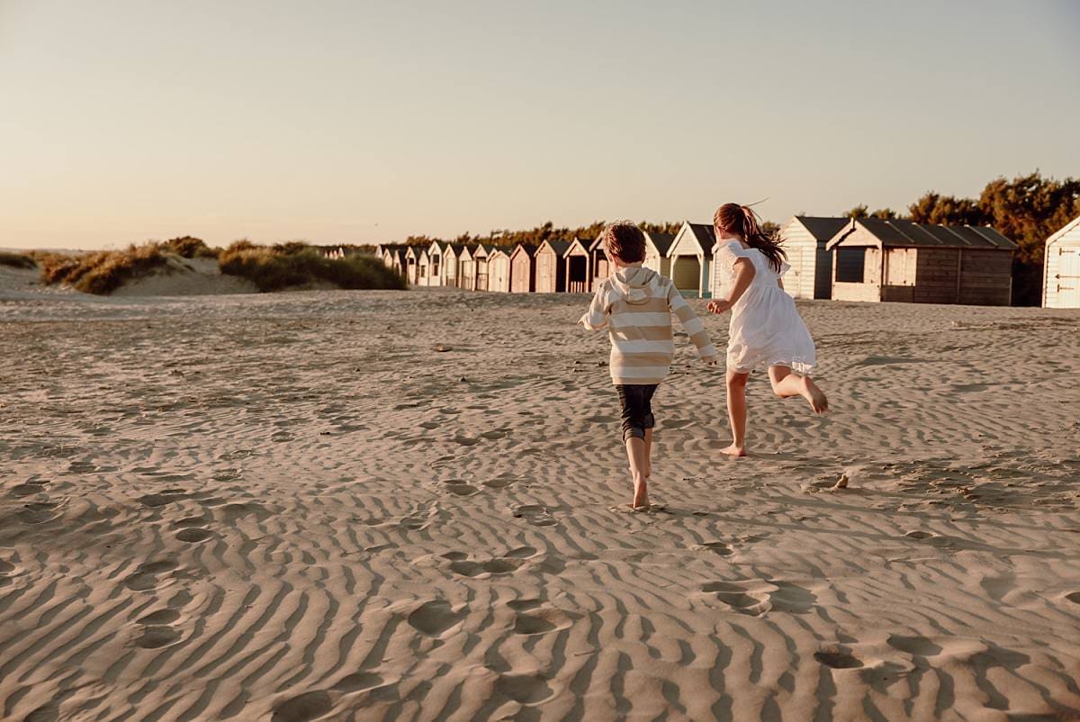 children running on the beach