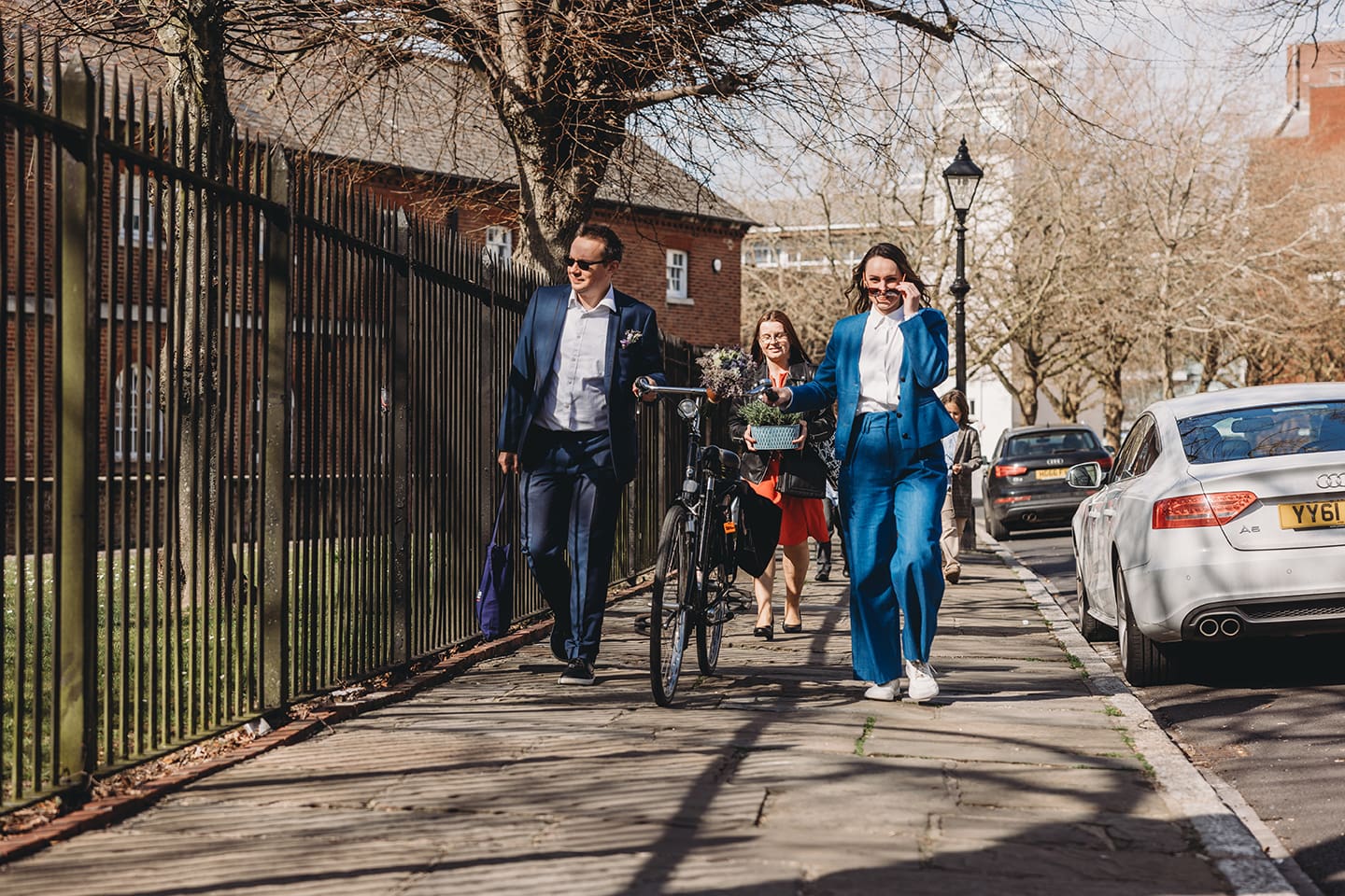 Portsmouth register office wedding photography couple on bicycle bride in blue linen suit