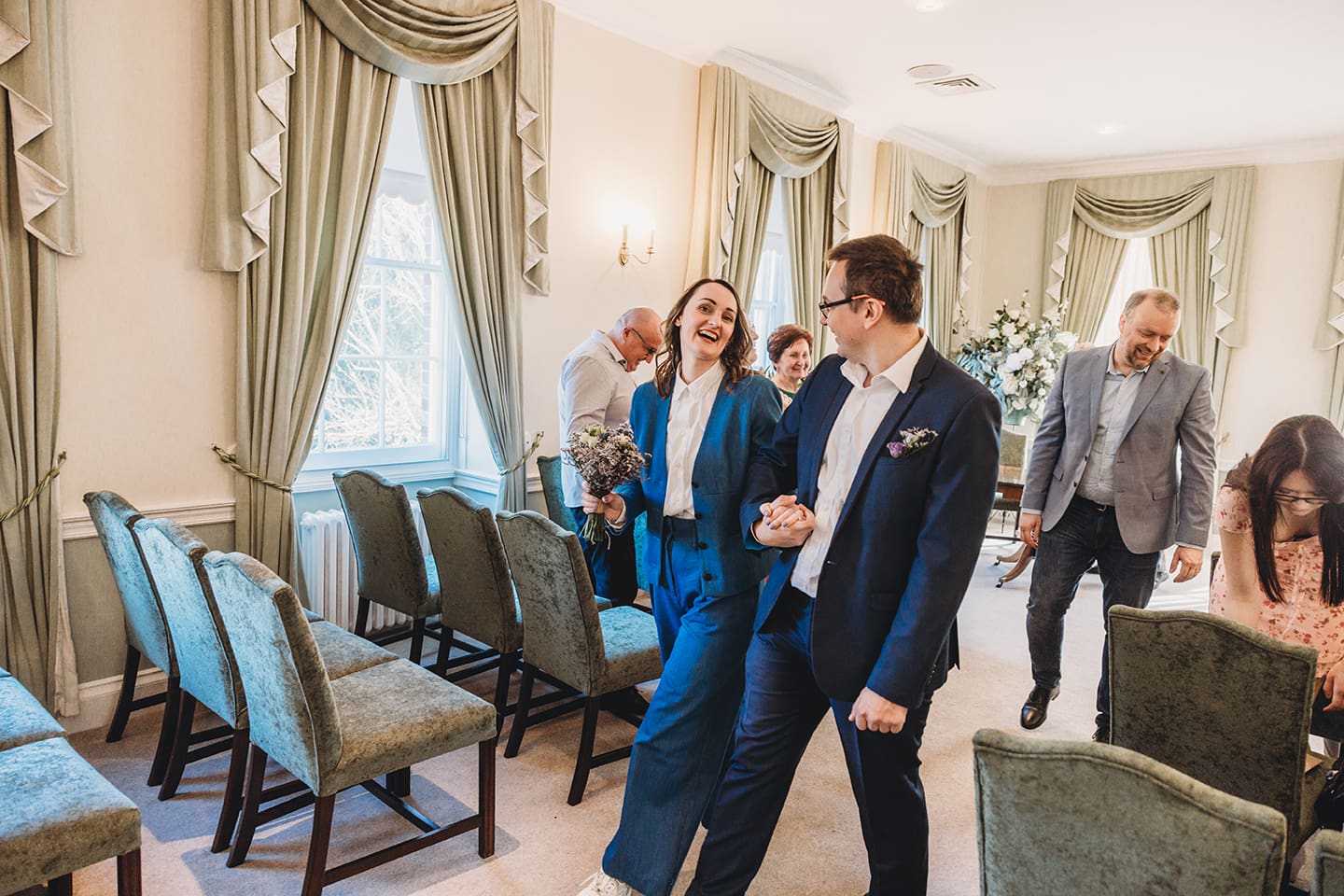 Portsmouth register office wedding photography couple on bicycle bride in blue linen suit
