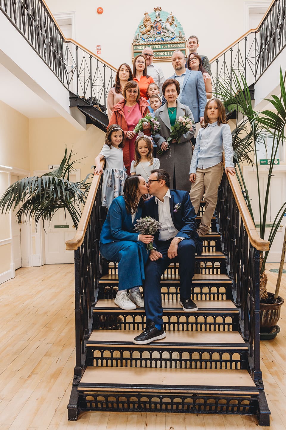 Portsmouth register office wedding photography couple on bicycle bride in blue linen suit