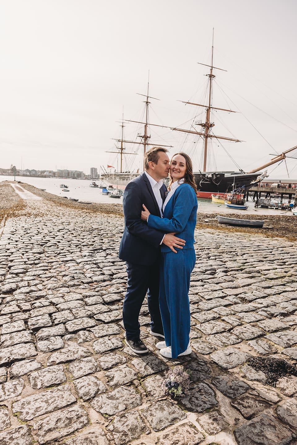 Portsmouth register office wedding photography couple on bicycle bride in blue linen suit