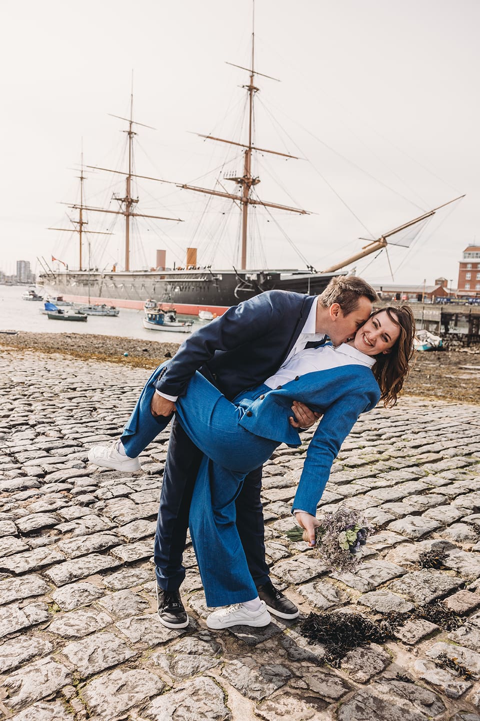 Portsmouth register office wedding photography couple on bicycle bride in blue linen suit