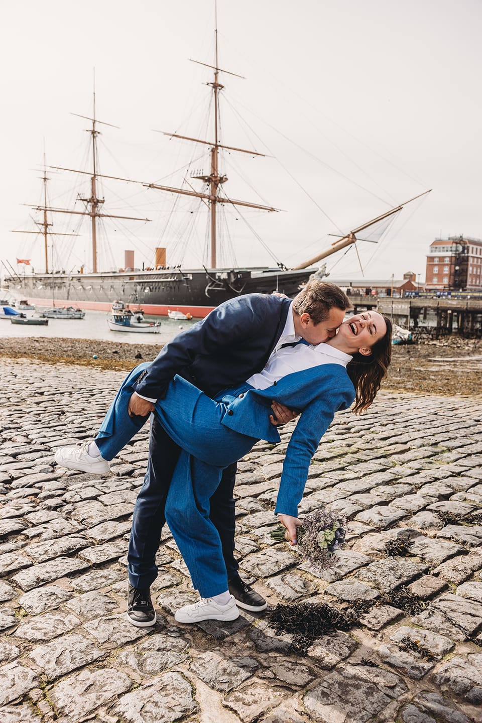 Portsmouth register office wedding photography couple on bicycle bride in blue linen suit