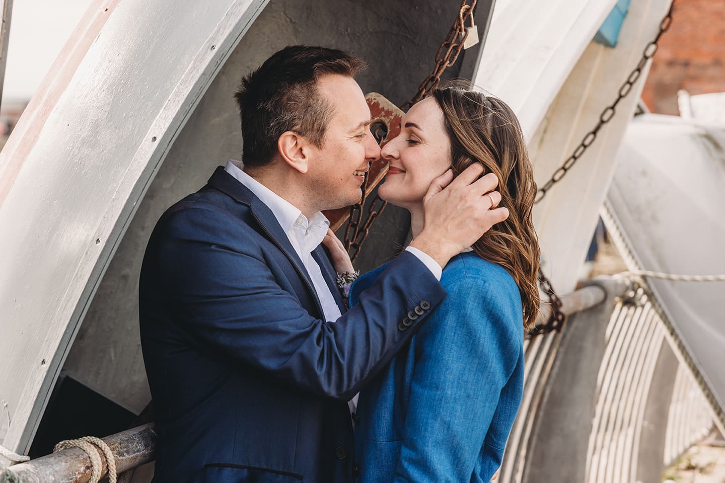 Portsmouth register office wedding photography couple on bicycle bride in blue linen suit