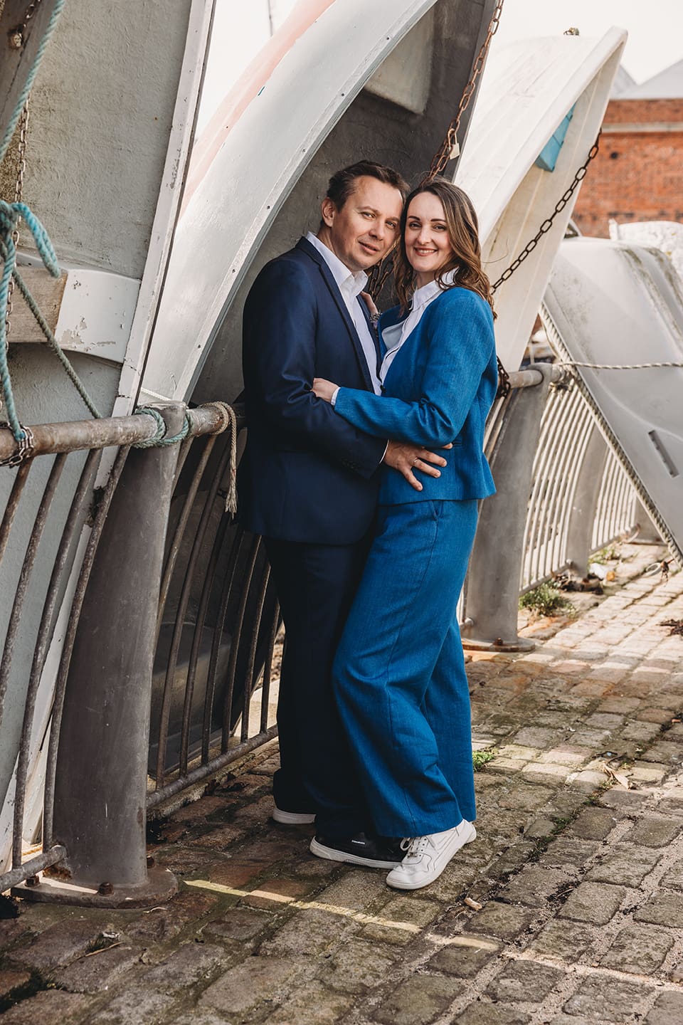 Portsmouth register office wedding photography couple on bicycle bride in blue linen suit