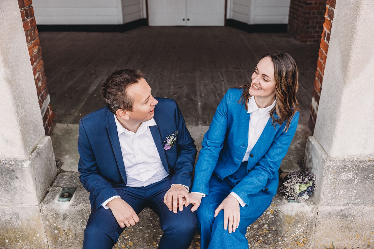 Portsmouth register office wedding photography couple on bicycle bride in blue linen suit