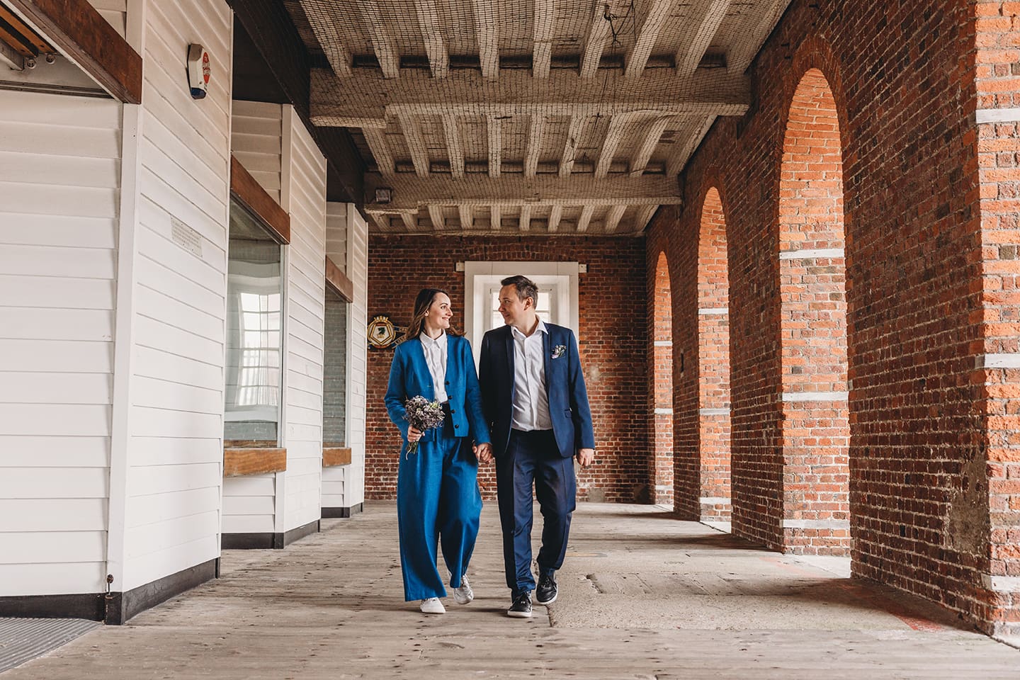Portsmouth register office wedding photography couple on bicycle bride in blue linen suit