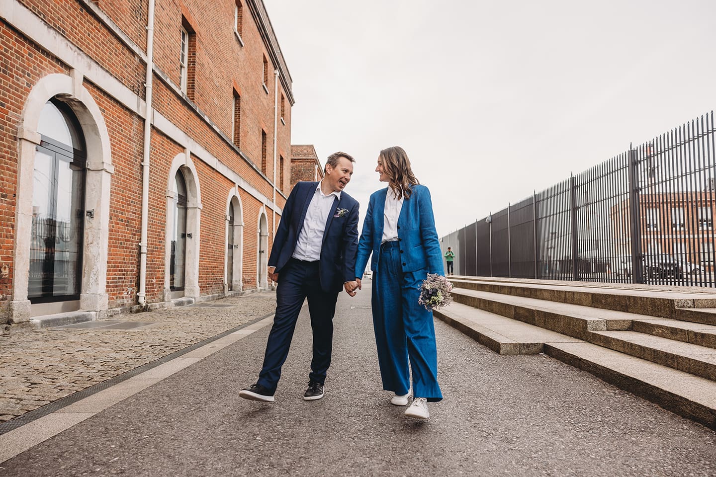 Portsmouth register office wedding photography couple on bicycle bride in blue linen suit