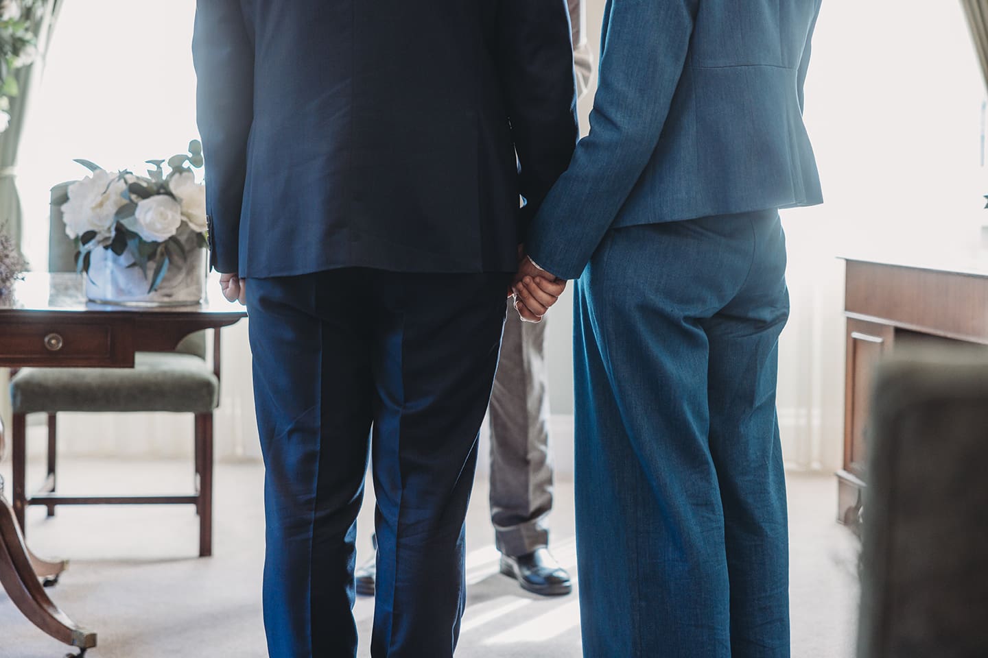 Portsmouth register office wedding photography couple on bicycle bride in blue linen suit