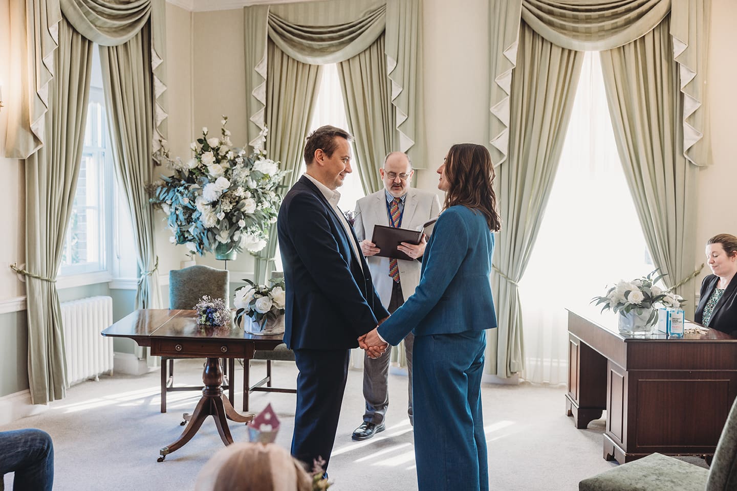 Portsmouth register office wedding photography couple on bicycle bride in blue linen suit