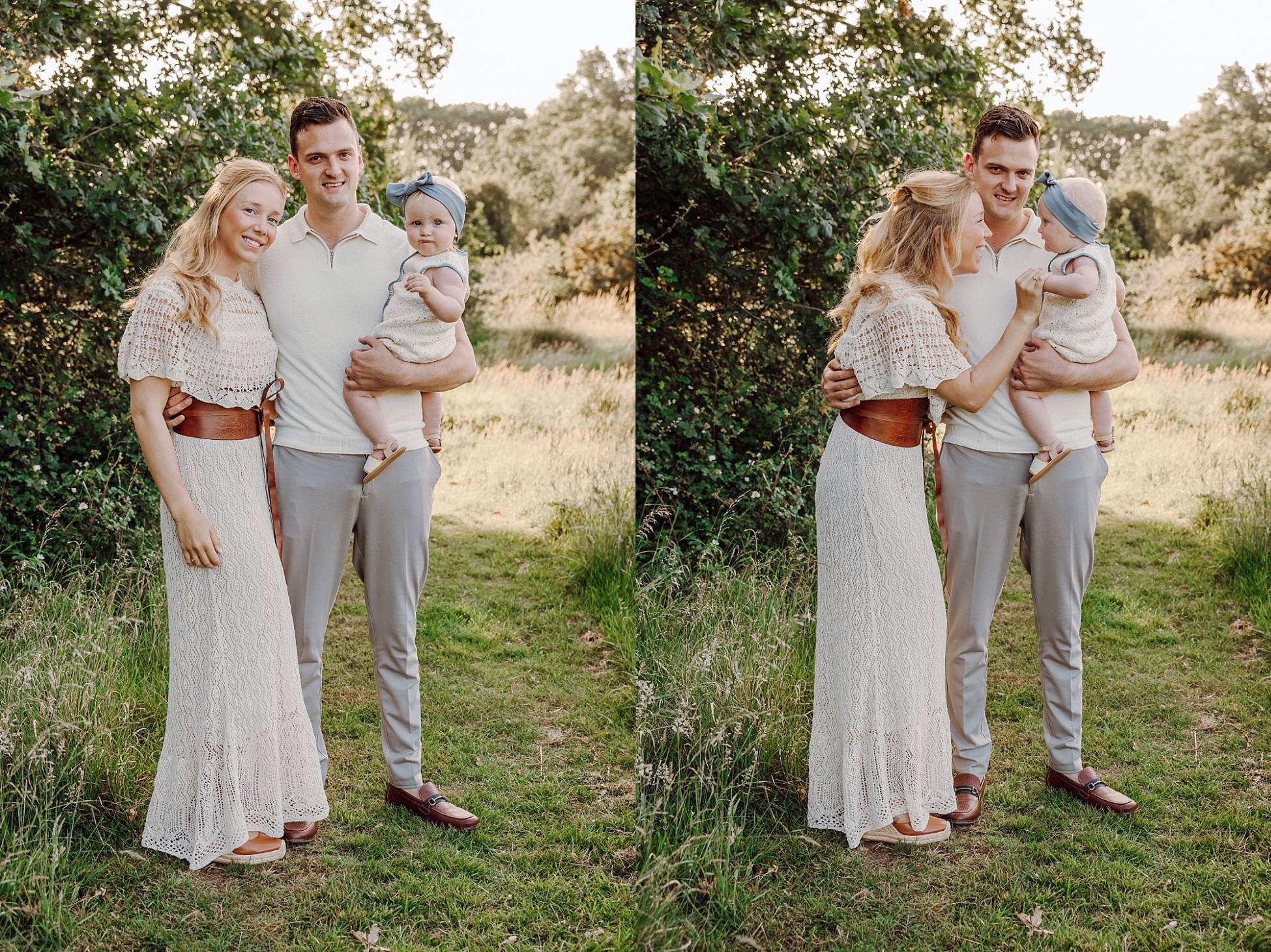 Family of three standing in a meadow near Waterlooville at golden hour