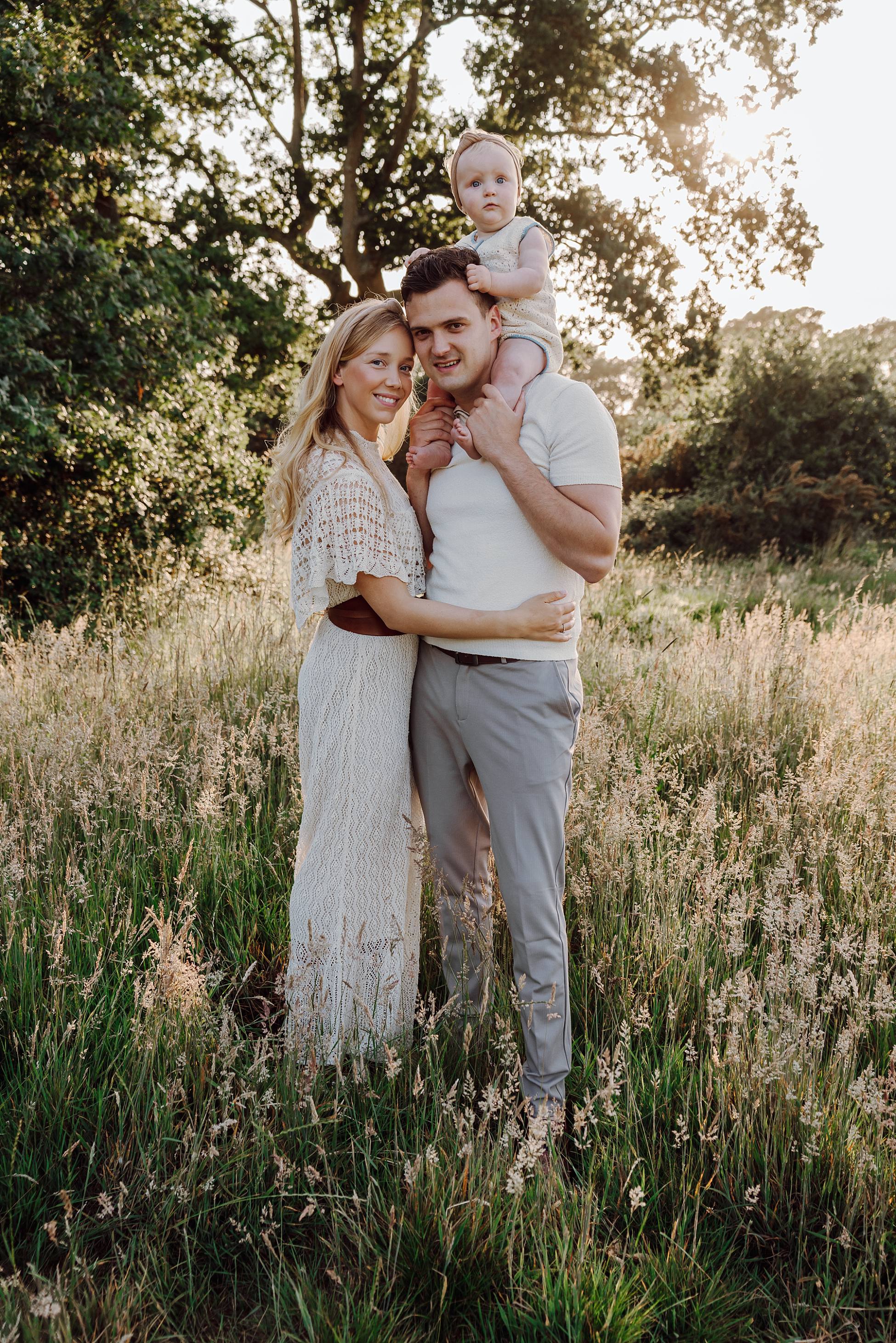 Family portrait in meadow near Waterlooville at sunset