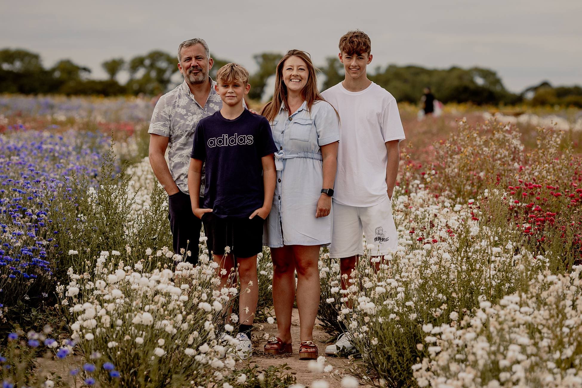 Natural outdoor family photography in Hayling Island at Sam’s Sunflowers, capturing relaxed portraits among the sunflower fields