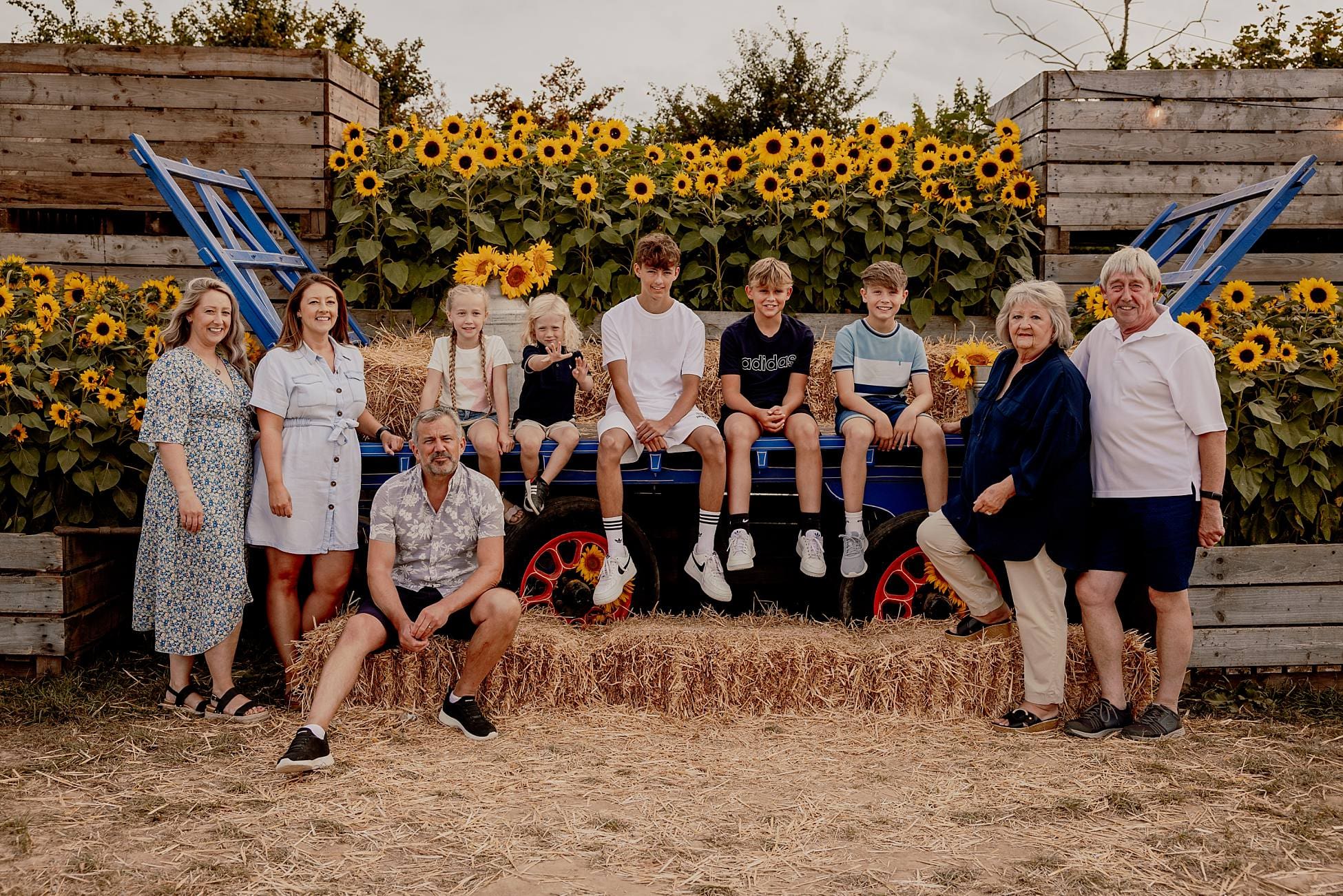 Three-generation family portrait in sunflower field at Sam’s Sunflowers Hayling Island