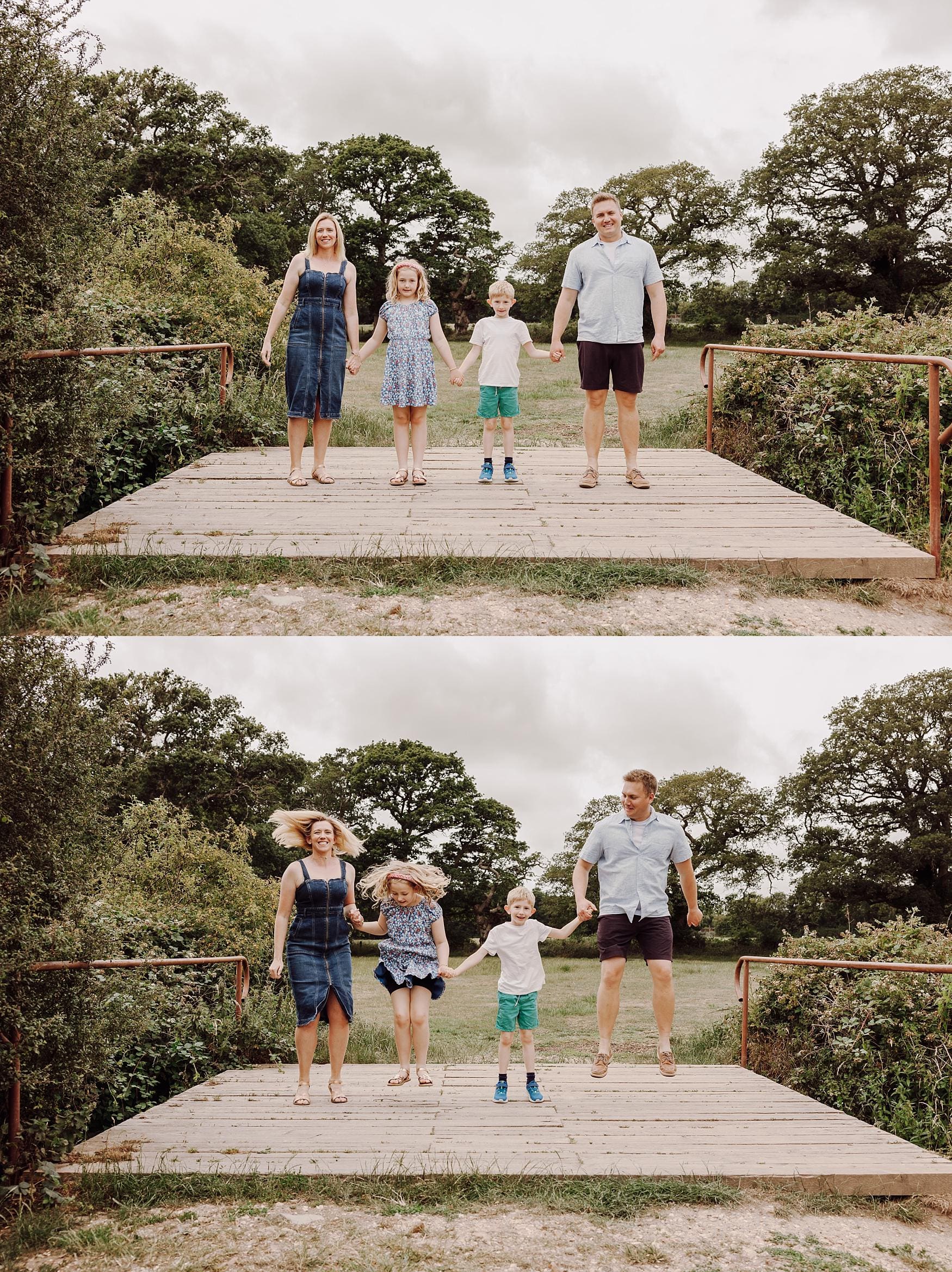 Family holding hands and jumping together on a wooden bridge during a fun outdoor photoshoot in Hampshire.