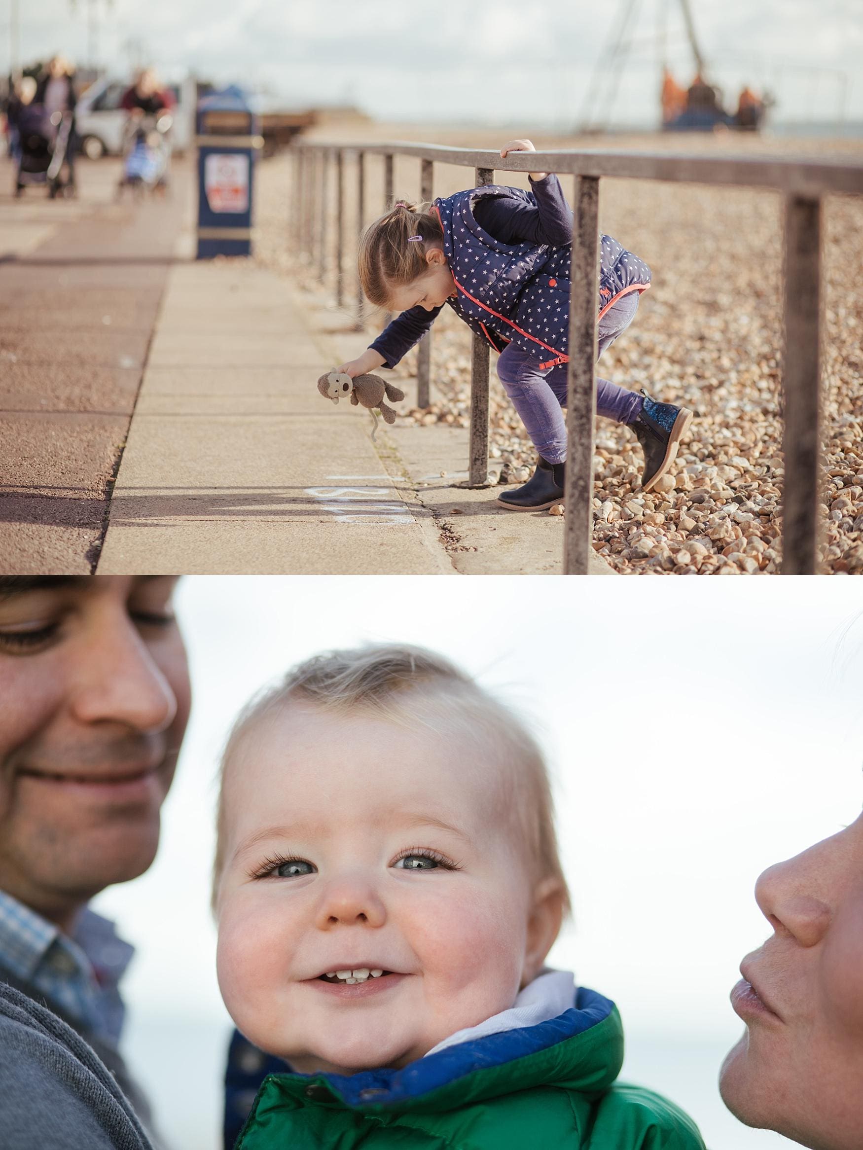 Little girl playing with her toy monkey near Southsea pebble beach, captured during a candid family photography session.