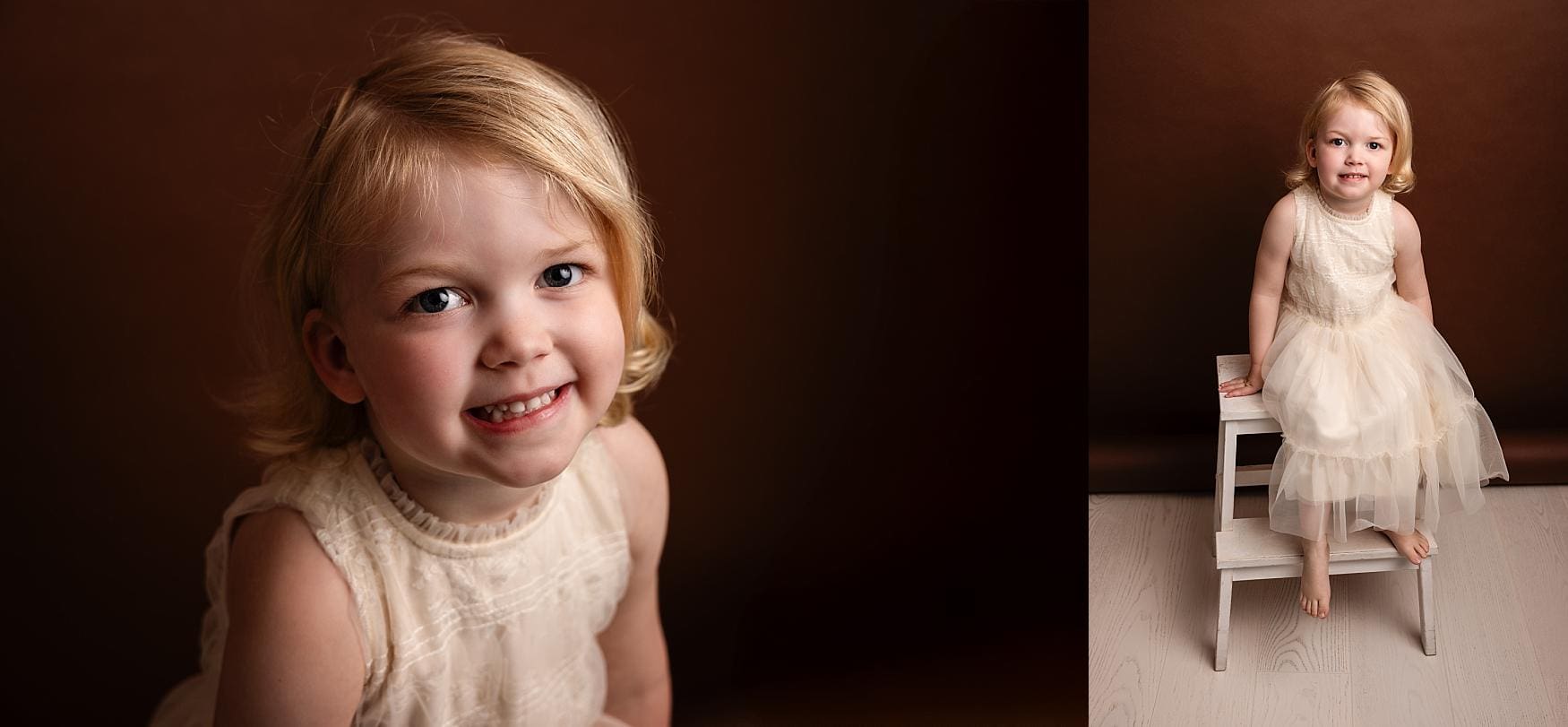 Portrait of a young girl in a cream dress smiling against a warm brown backdrop