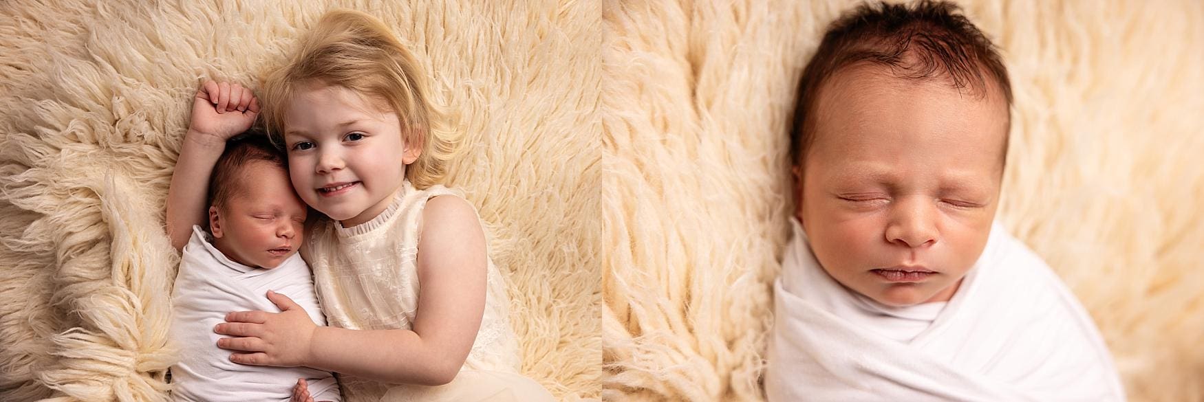 Big sister cuddling her newborn baby brother while lying on a soft cream blanket