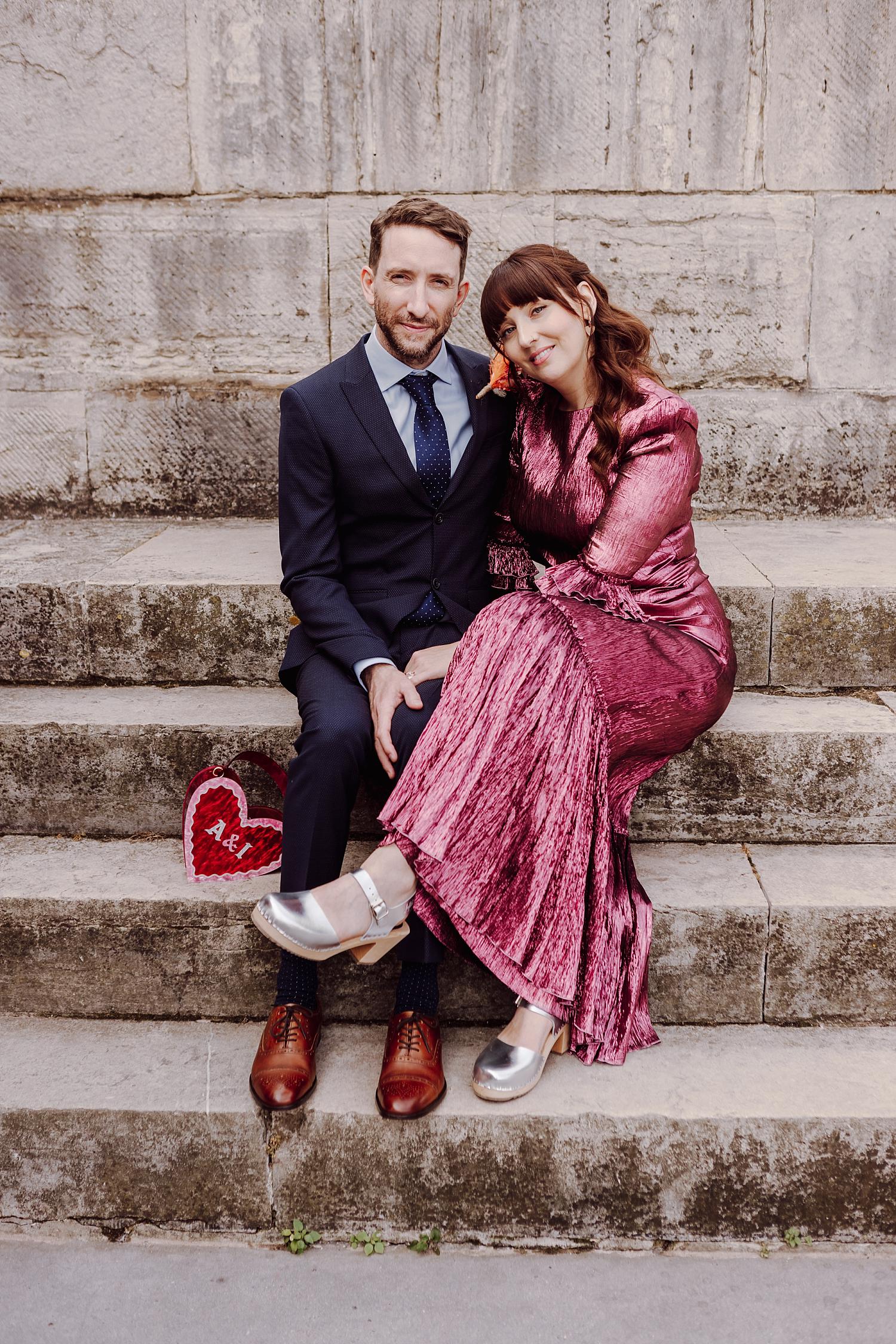Intimate wedding portrait of couple sitting on Old Portsmouth stone steps after their register office ceremony