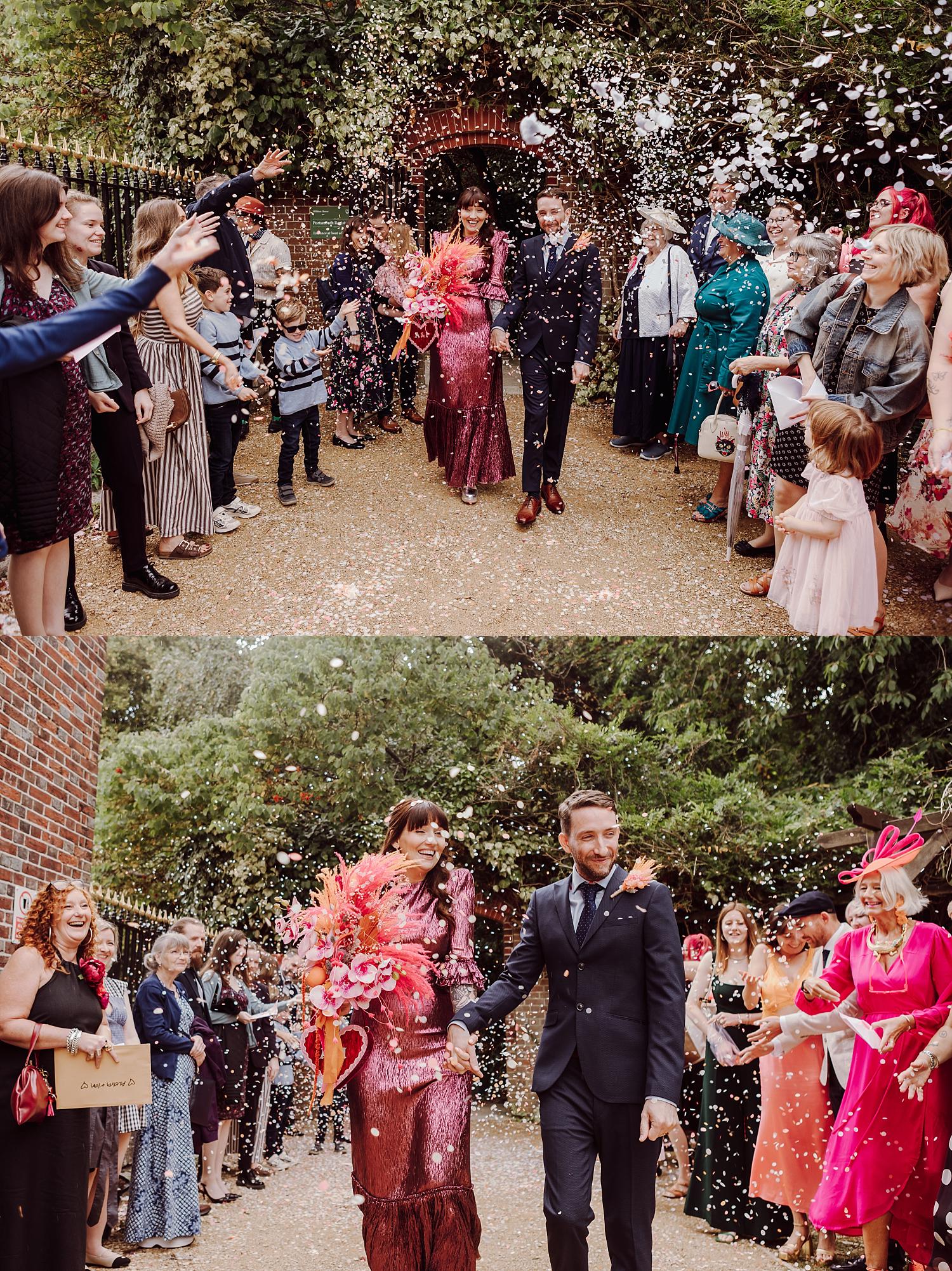 Confetti celebration in Portsmouth Register Office garden after an intimate wedding ceremony