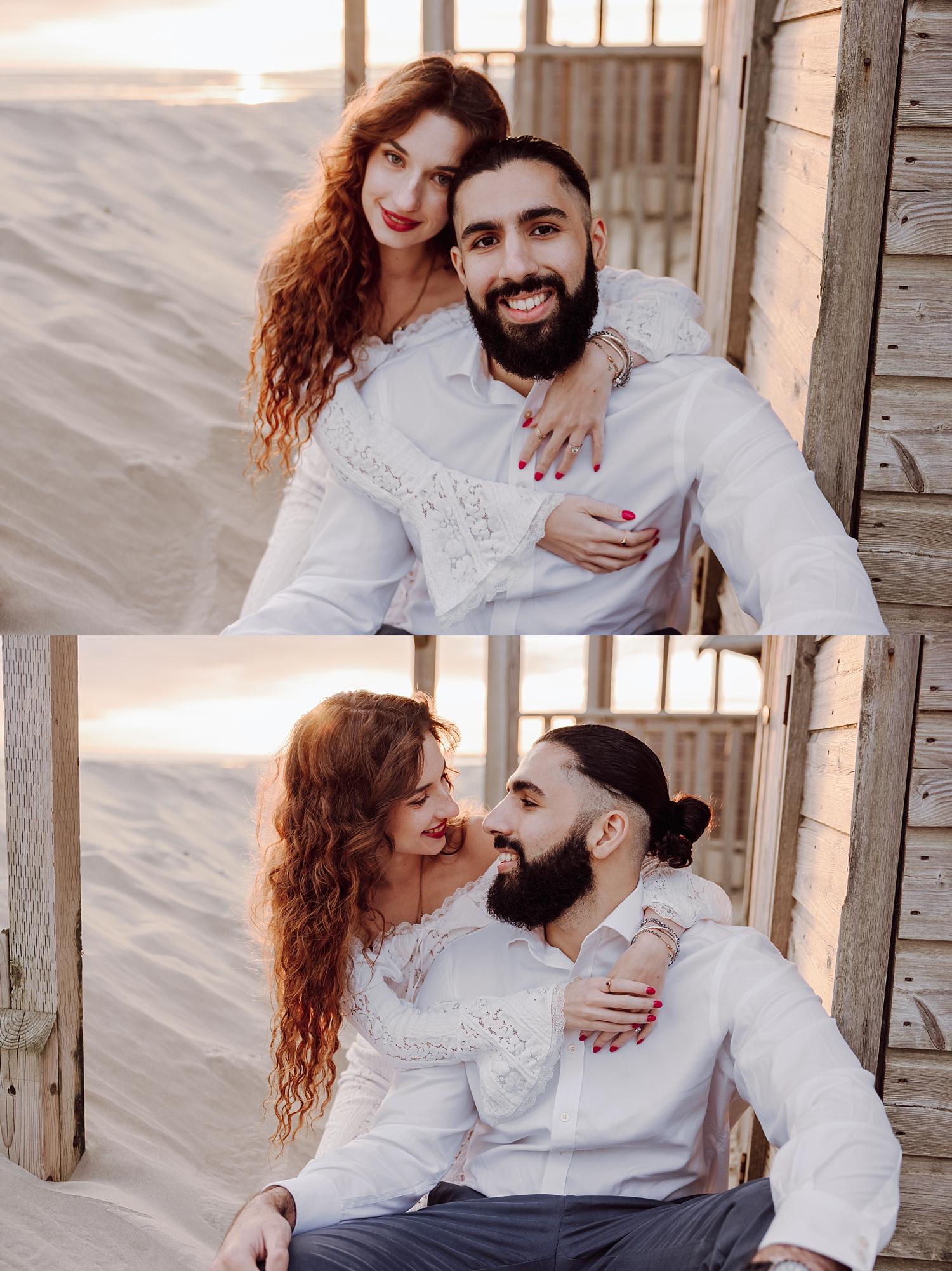 Engaged couple smiling together at West Wittering Beach during sunset engagement photography session.