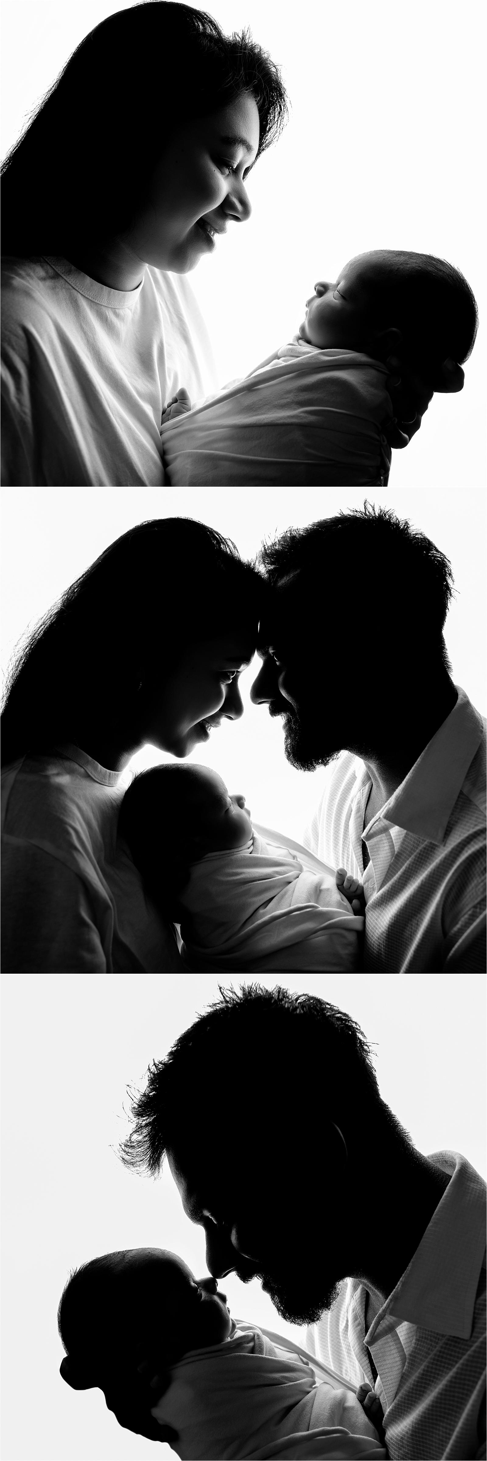 Black and white silhouette of parents gazing at each other with newborn baby, Littlehampton West Sussex