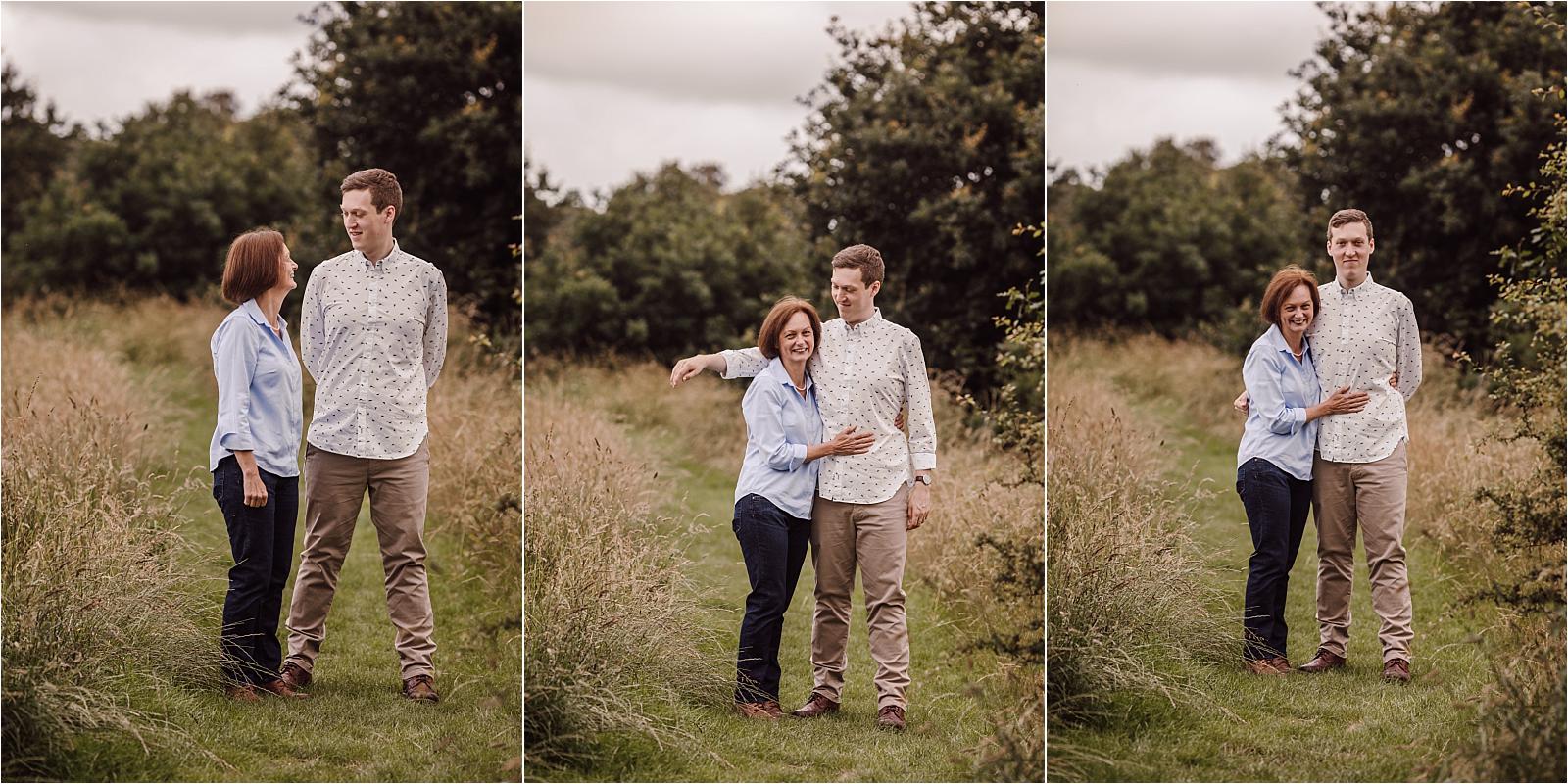 Relaxed family portraits on a wooden boardwalk surrounded by oak trees and open fields