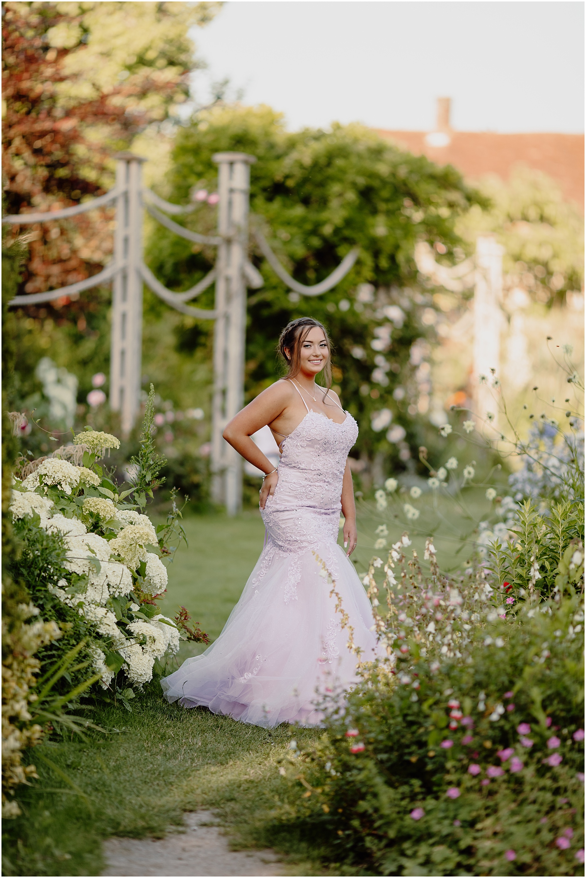 Standing among the tall white flowers: Prom photoshoot Chichester with a teenager standing among white summer borders