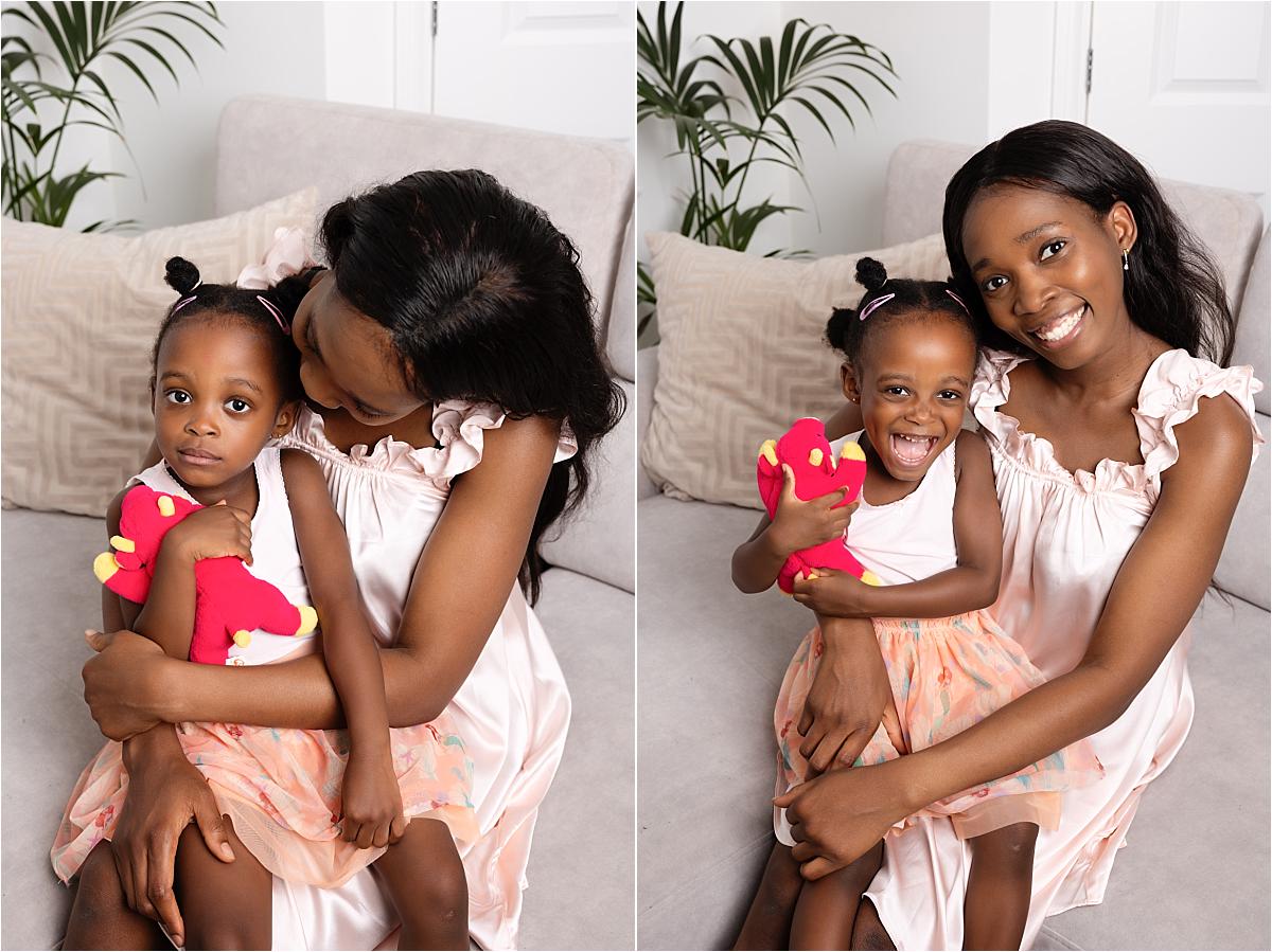 mum-and-daughter-newborn-session-havant Mum laughing with her older daughter during a newborn photography session at home