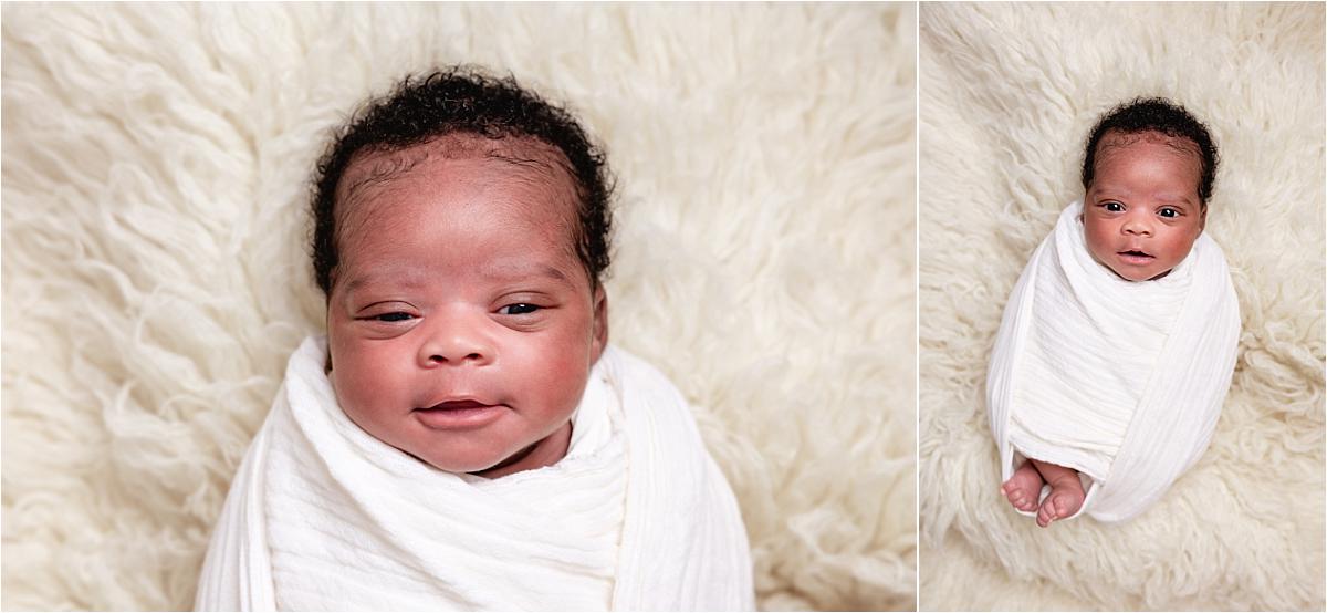 newborn-photographer-havant-wrapped-baby Newborn photographer Havant image of a swaddled baby awake on a cream fur blanket